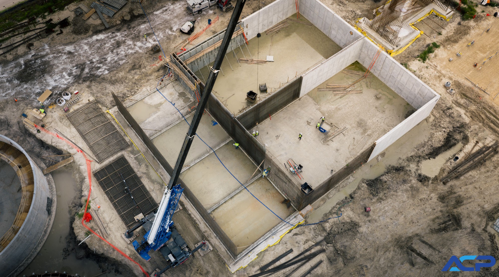 Cast-in-place concrete structure under construction with a crane